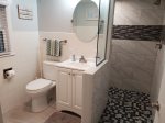 Fully renovated lower level bathroom with tiled shower